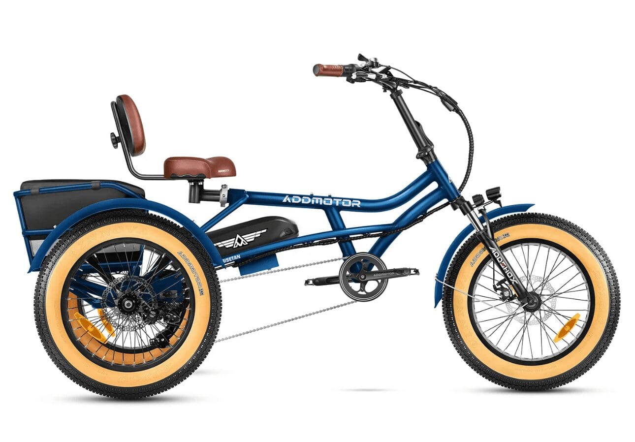 A blue tricycle with two seats and a handle bar.