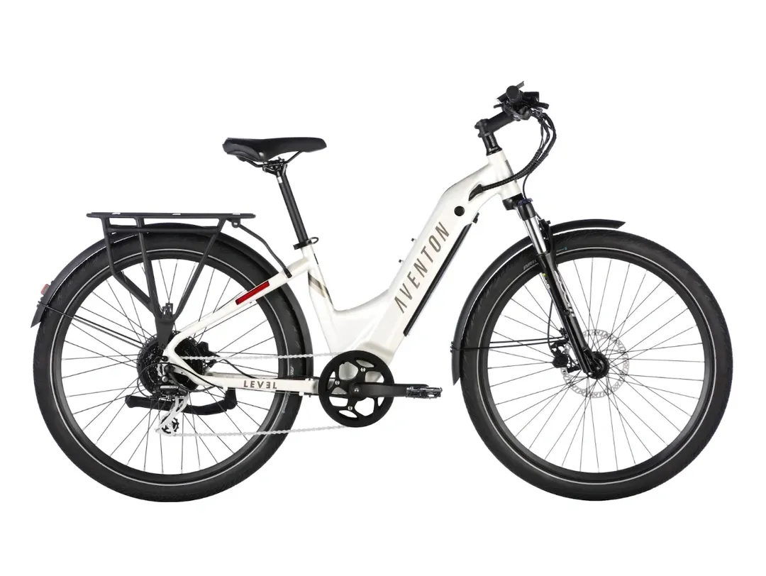 A white bicycle with black wheels and red accents.