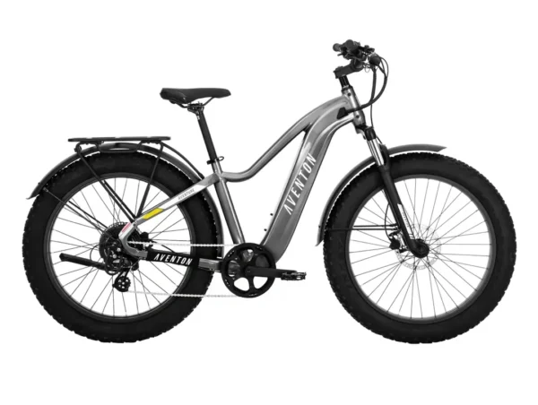 A silver bike with black wheels and a yellow handle.