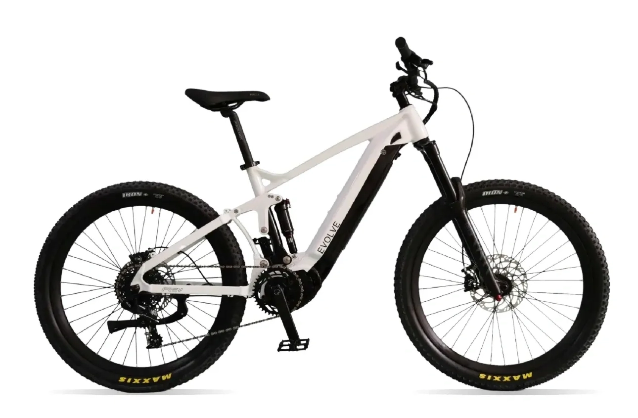 A white electric bike is parked on the ground.